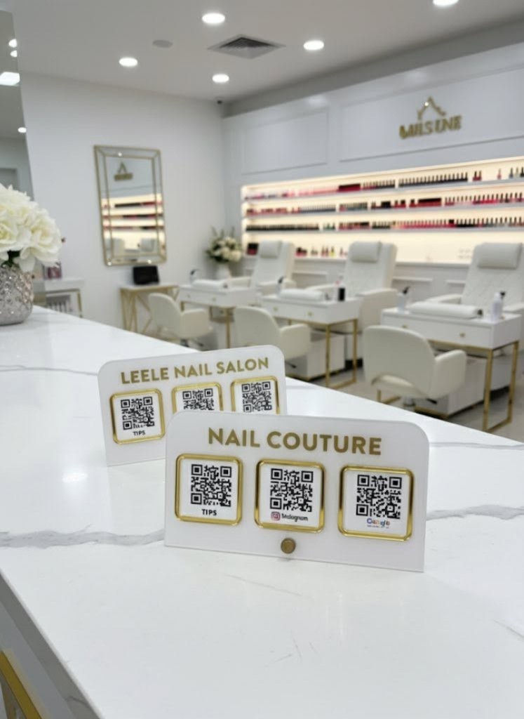TapMeGo stands at a salon reception counter
